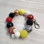 Black, Yellow, and Red Ears Wristlet