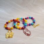 Multicolor Beaded Bracelet with Purse, Face, and Queen Charms